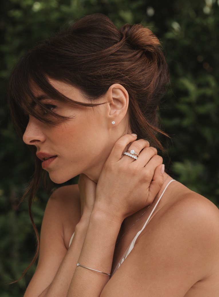 woman wearing necklace, earrings, rings and lepage bracelet 