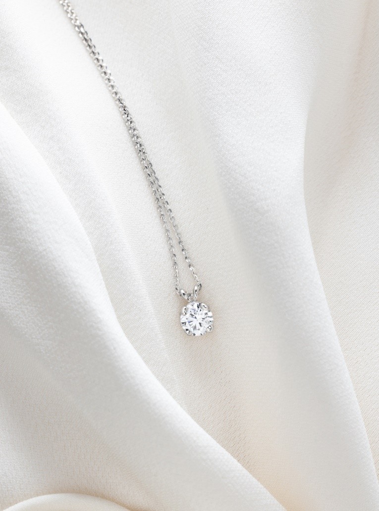 still life gold and diamond omen necklace 