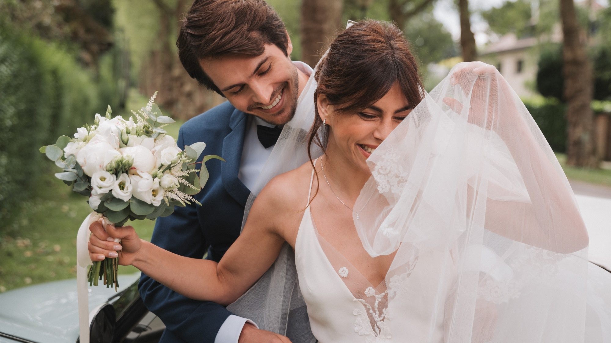 Bride and groom wearing jewellery by Maison Lepage 