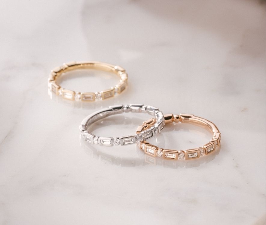 a mix of three rings in three different golds 
